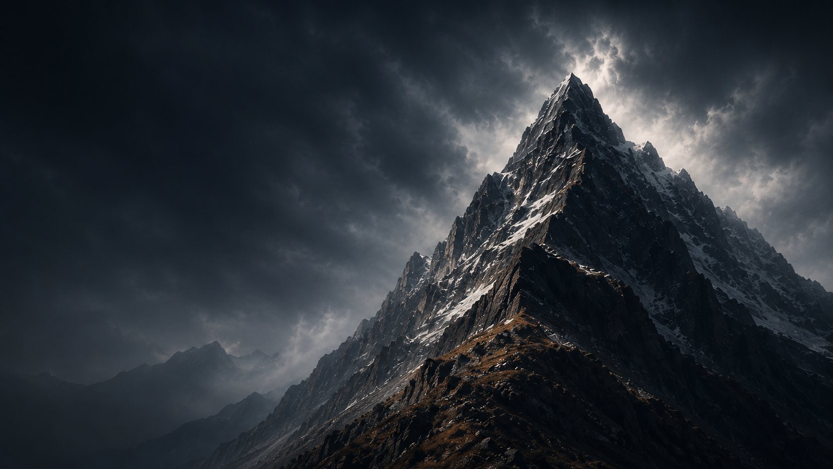 A dark mountain peak beneath a stormy sky
